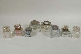A collection of antique glass ink wells, largest 7.5 x 7.5cm