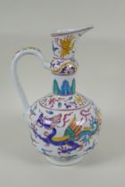 A Chinese polychrome porcelain ewer decorated with dragons and birds, in bright enamels, Xuande 6