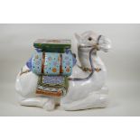 A Chinese ceramic garden seat in the form of a camel, 60cm long, 45cm high