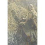 A vintage photographic print, woman climbing rocks, 26 x 37cm