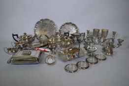 A quantity of silver plate to include tea sets, serving trays, coasters, goblets etc