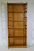 A mid-century mahogany open bookcase of six shelves, 76 x 26 x 180cm