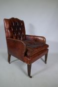 A Cornelius V Smith small Victorian button back leather armchair, stamped CVS, AF