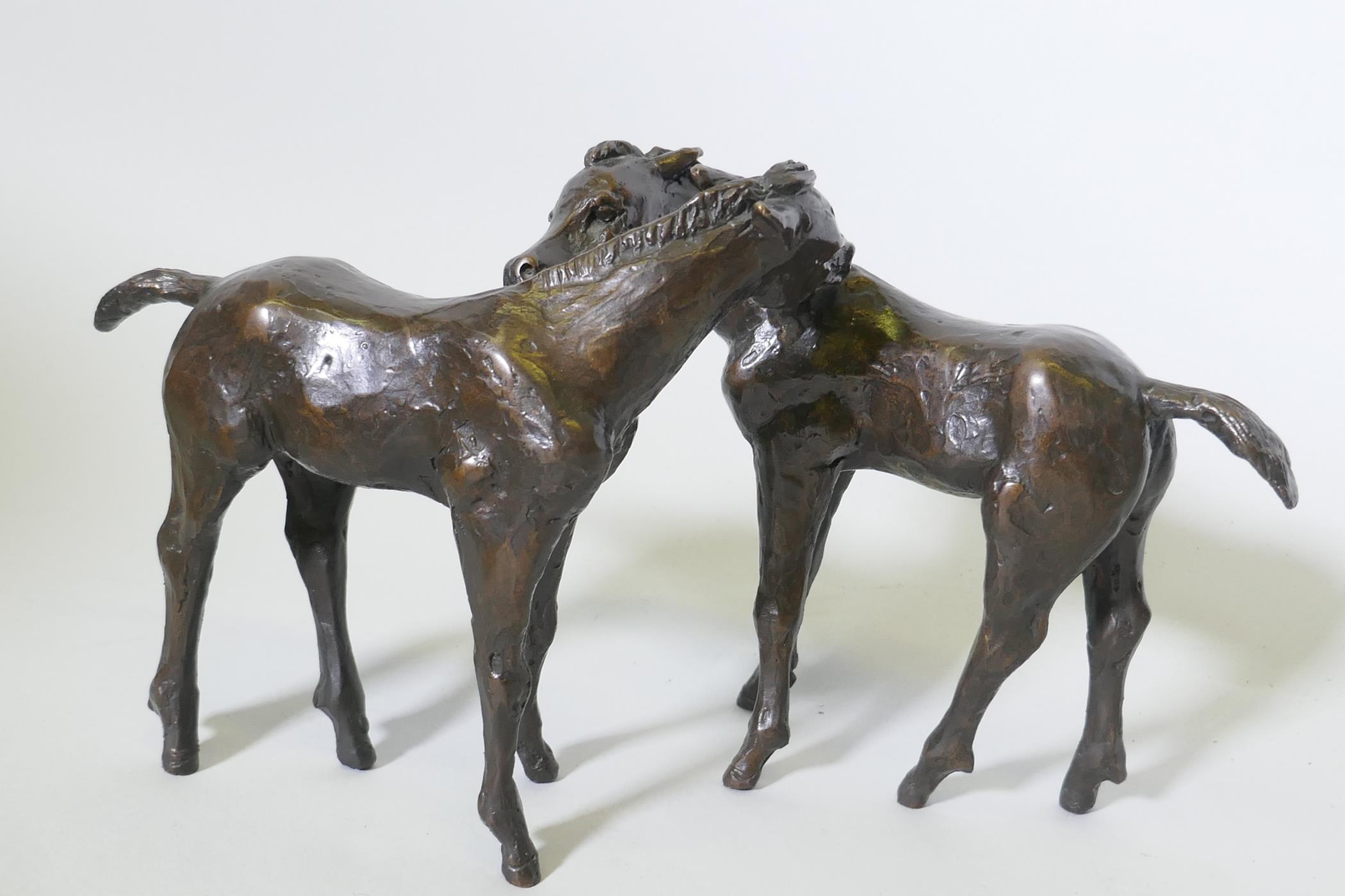 Kurt Arentz, bronze model of two horses, signed and numbered 2-25, 18cm high