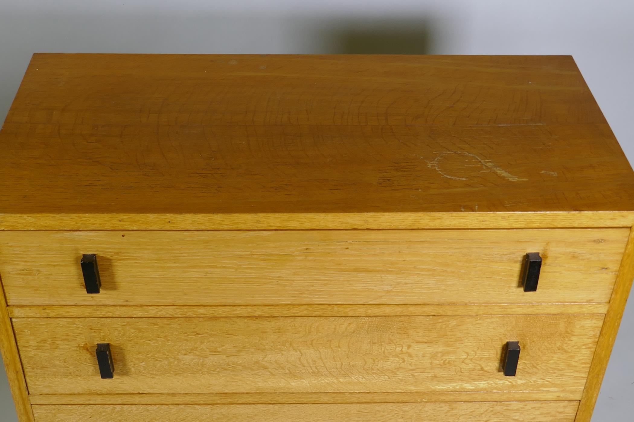 A mid-century oak chest of four long drawers, 92 x 43 x 83cm - Image 3 of 3