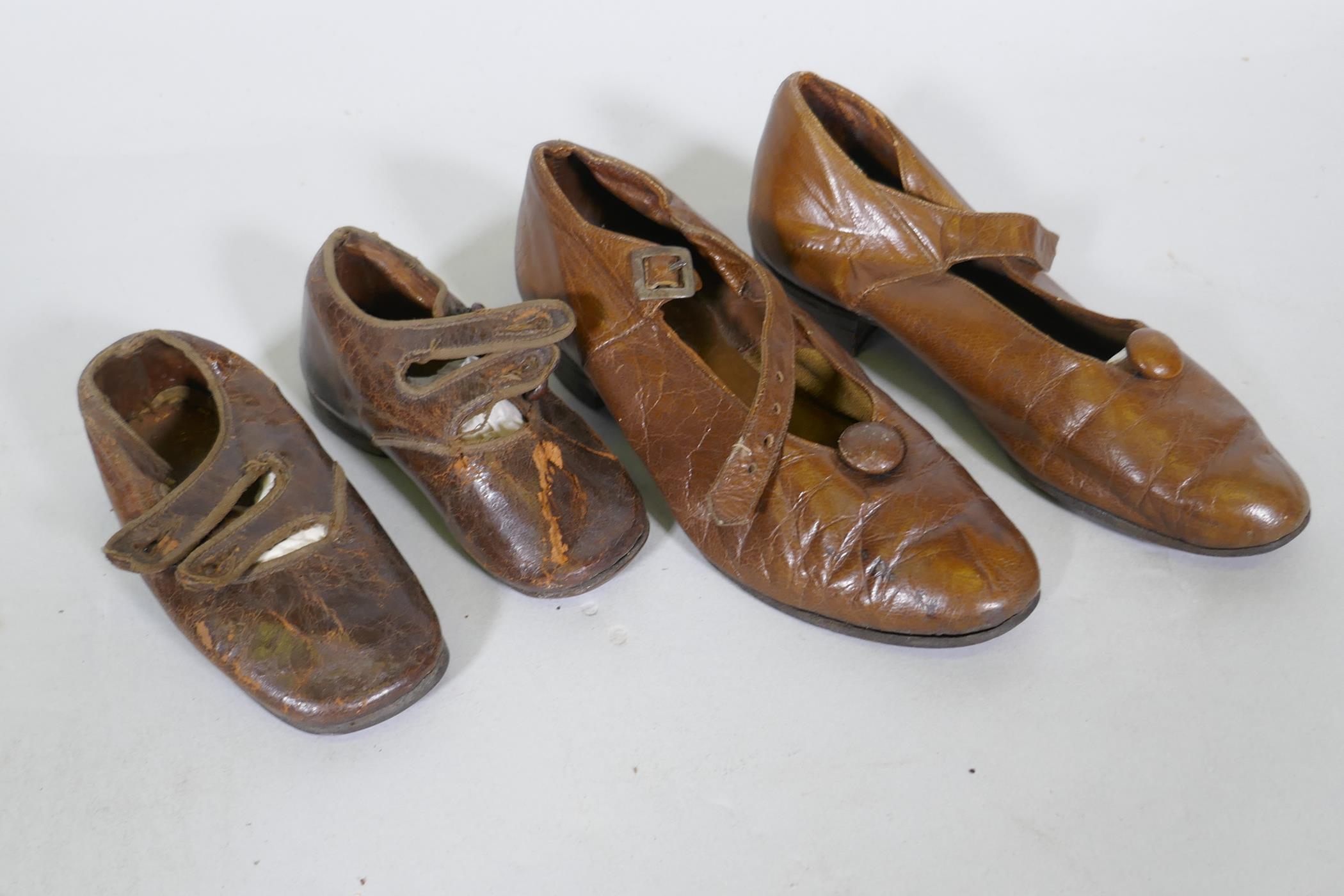 A pair of late C19th/early C20th child's leather shoes, 12cm long, and another pair larger