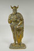 A figural brass doorstop in the form of a viking, 56cm high