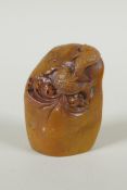 A Chinese carved soapstone seal decorated with carp, 7cm high
