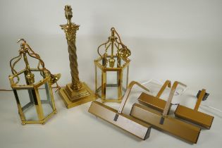 A brass Corinthian column table lamp, a pair of brass and glass hexagonal lanterns and four