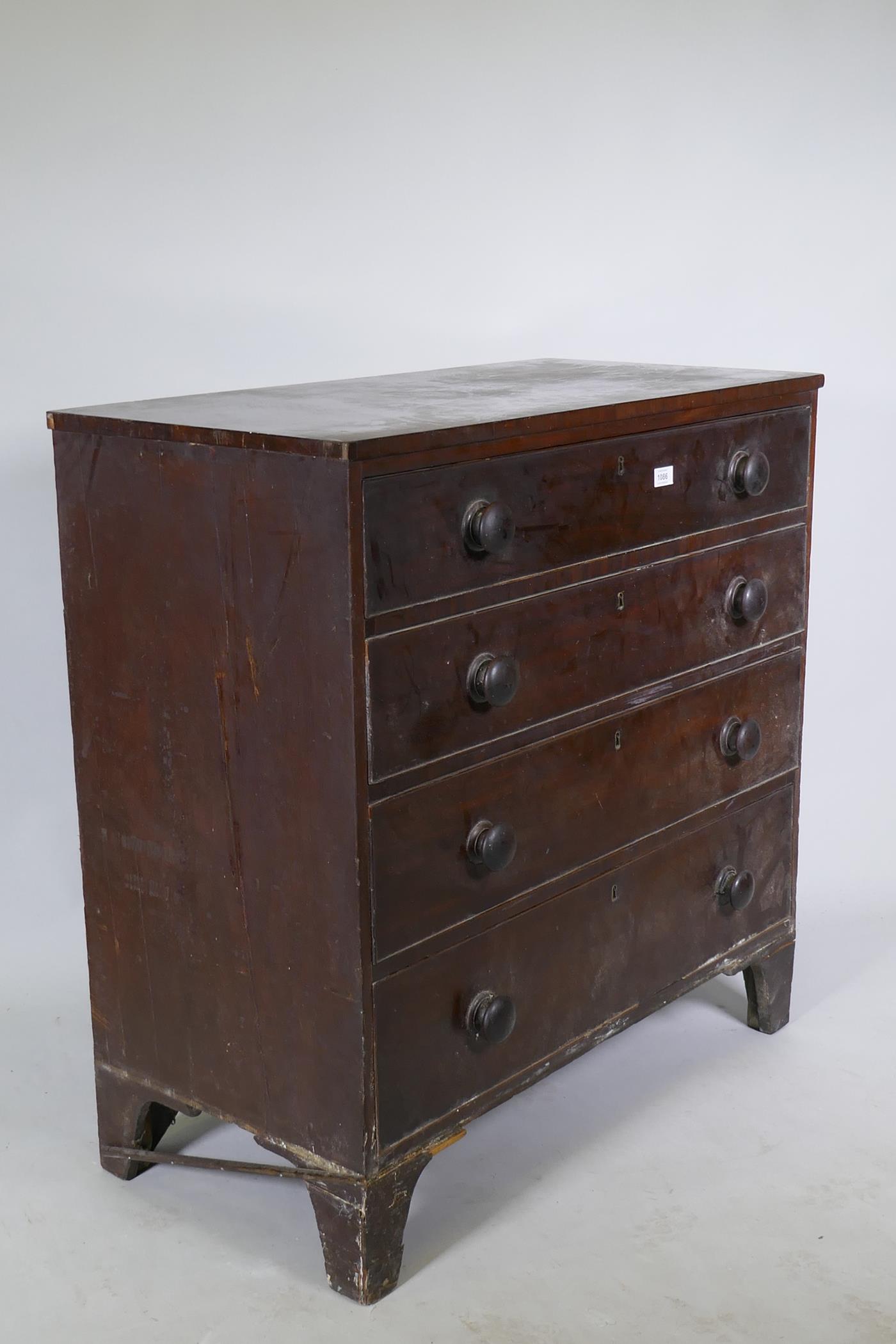 A Georgian mahogany chest of four long drawers, with cockbeaded detail and wooden knobs, raised on - Image 4 of 5