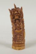 A Balinese bone carving of a female wrathful deity, 11cm high