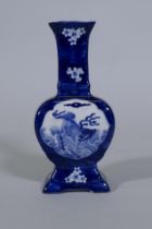 A Chinese blue and white vase with kylin and prunus blossom decoration, 24cm high