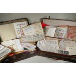 A large quantity of C19th, C20th and world postage stamps in albums, loose and attached to postcards