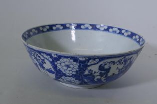 A C19th Chinese blue and white bowl with cracked ice and prunus blossom decoration inset with