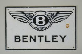 A 'Bentley' painted cast iron wall plaque, 30 x 19cm
