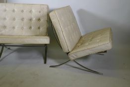 A pair of Barcelona style chairs, chromed steel frames and leather cushions, lack webbing