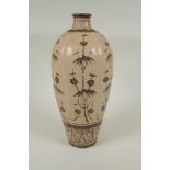 A Chinese Cizhou kiln pottery vase of ribbed form with painted bamboo style decoration, 32cm high,