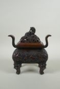A Chinese bronze two handles censer and cover, with allover kylin decoration and lion mask feet,