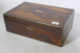 A Victorian rosewood writing box with brass mounts, fitted interior with gilt tooled leather