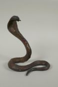 A Tibetan gilt bronze figure of a cobra, 18cm high