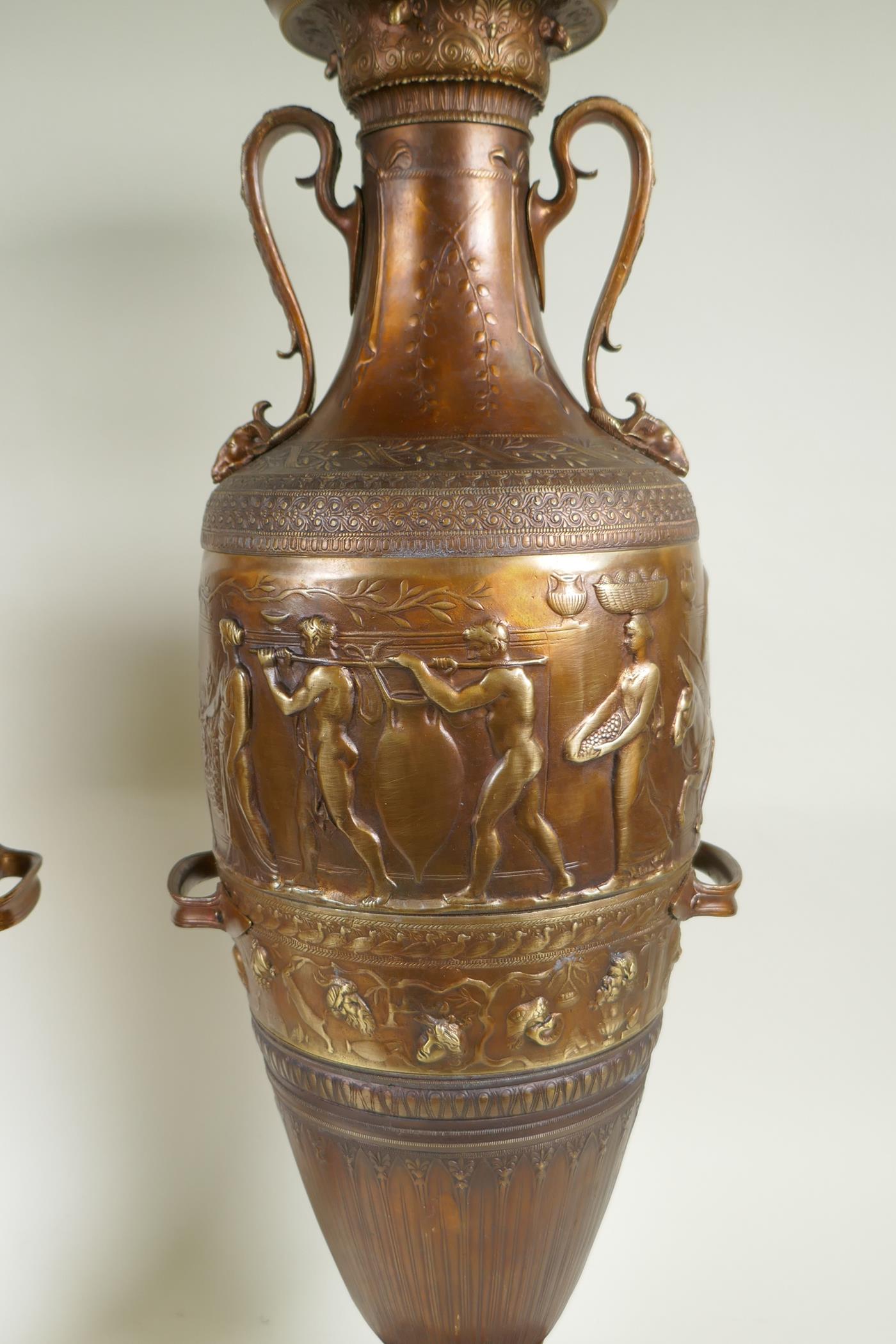 After Barbedienne, a pair of bronze Grand Tour style urns with two handles and raised figural - Image 3 of 9