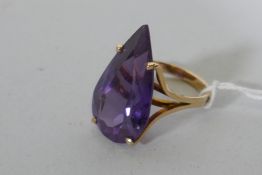 A vintage 14ct yellow gold dress ring set with a large amethyst coloured gemstone, Israeli hallmark,