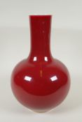 A Chinese flambe glazed porcelain bottle vase, KangXi 6 character mark to base, 33cm high