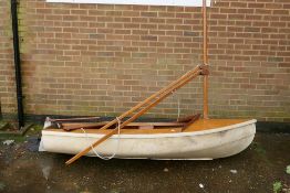A vintage sailing dinghy, 233 x 107cm beam