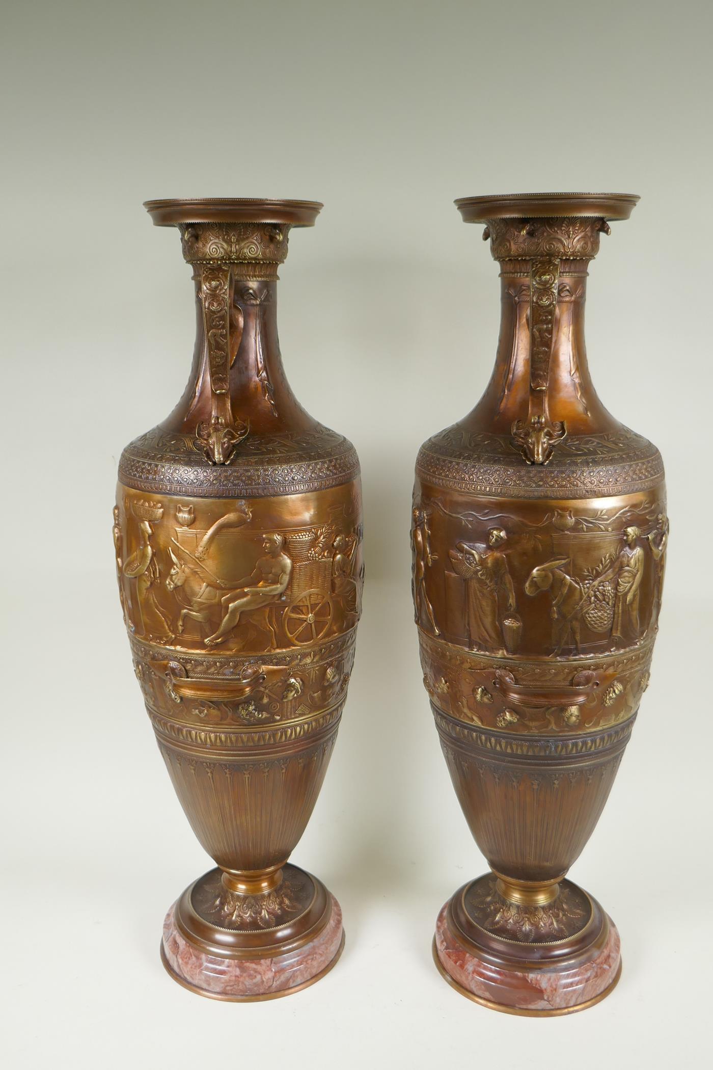 After Barbedienne, a pair of bronze Grand Tour style urns with two handles and raised figural - Image 6 of 9