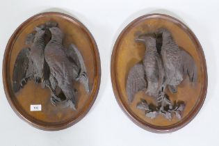 A pair of C19th oak wall plaques with finely carved braces of woodland birds, 46 x 36cm