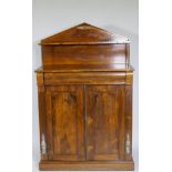 A small Regency rosewood chiffonier with brass stringing and mounts, the upper shelf raised on