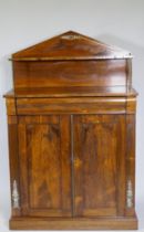 A small Regency rosewood chiffonier with brass stringing and mounts, the upper shelf raised on