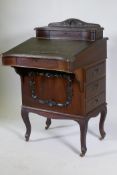 A Victorian mahogany Davenport, lift up top with fitted interior, fall front and three true and
