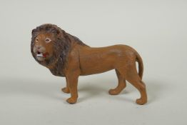An Austrian style cold painted bronze lion, after Bergmann, 10cm long