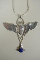 A sterling silver pendant necklace in the form of a winged beetle, set with lapiz, 9cm wide