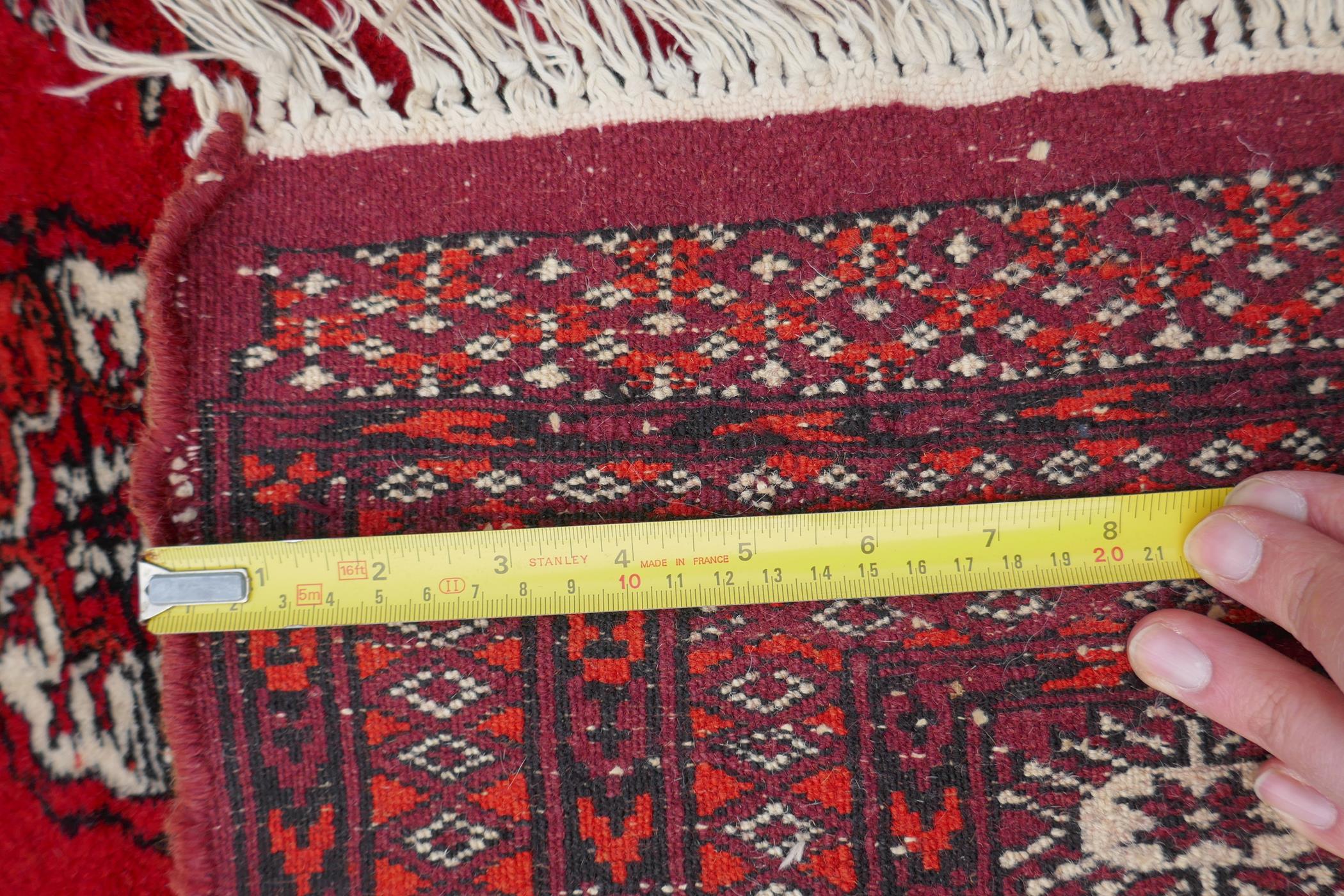 A red ground Bokhara rug with brown and orange borders, 128 x 175cm - Image 5 of 6