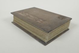 A Chinese wood and silk bound book with white jade tablets bearing chased and gilt inscriptions,