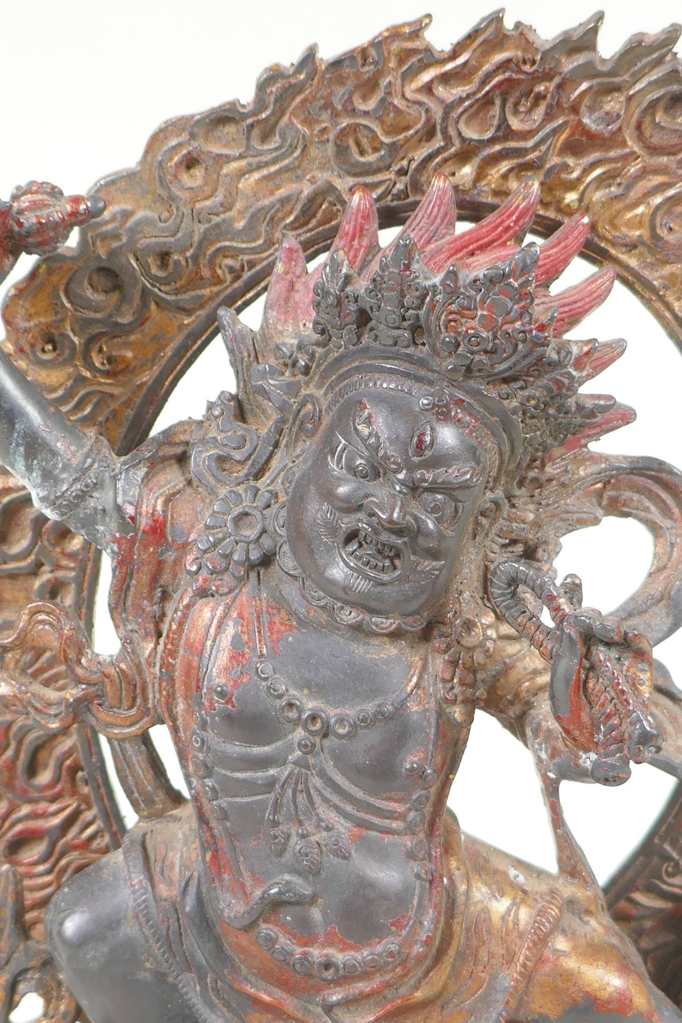 A Tibetan bronze figure of Vajrapani with remnants of gilt patina, 24cm high - Image 2 of 5