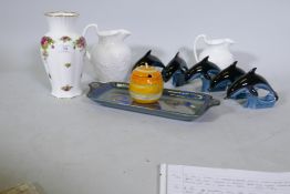 Five Poole Pottery dolphin's, two Wedgwood Strawberry & Vine jugs, a Royal Albert Country Rose vase,