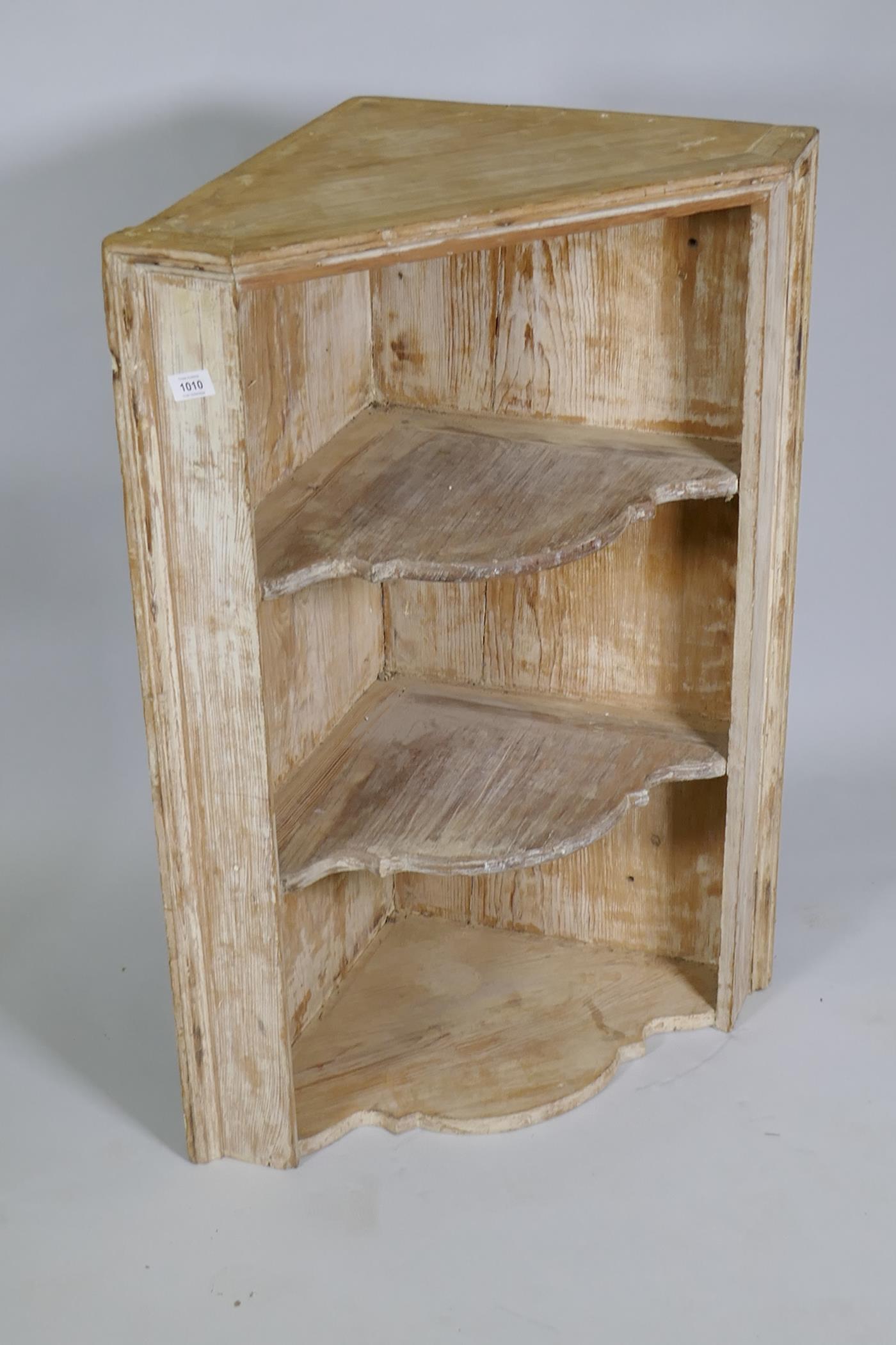 A C19th stripped pine hanging corner shelf, 66cm wide x 92cm high - Image 2 of 2