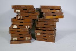 A set of twenty four mahogany front slide drawers, 51 x 3 x 5cm