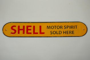 A 'Shell Motor Sport' painted cast iron wall plaque, 50cm long