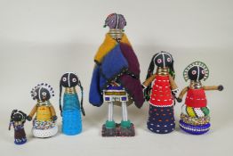A collection of South African Ndebele bead work dolls, largest 36cm high