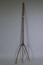 An antique pitchfork, 163cm long
