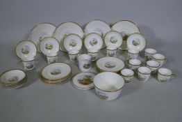 A Staffordshire six place tea set with hand painted decoration of landscape scenes and abbey