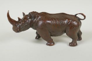 A filled bronze rhinoceros, 23cm long