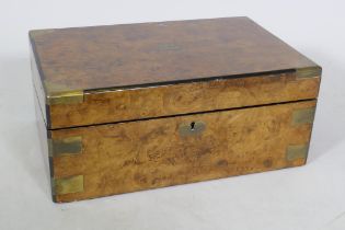 A Victorian burr walnut writing slope with brass mounts and fitted interior with inset leather slope