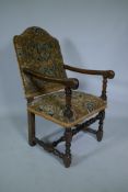 A C17th William and Mary walnut humpback open armchair on turned supports, circa 1690, historic