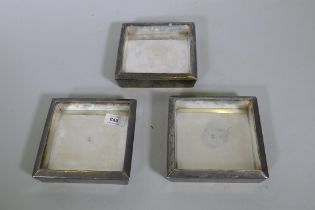 A set of three silver plated dishes, 16cm square