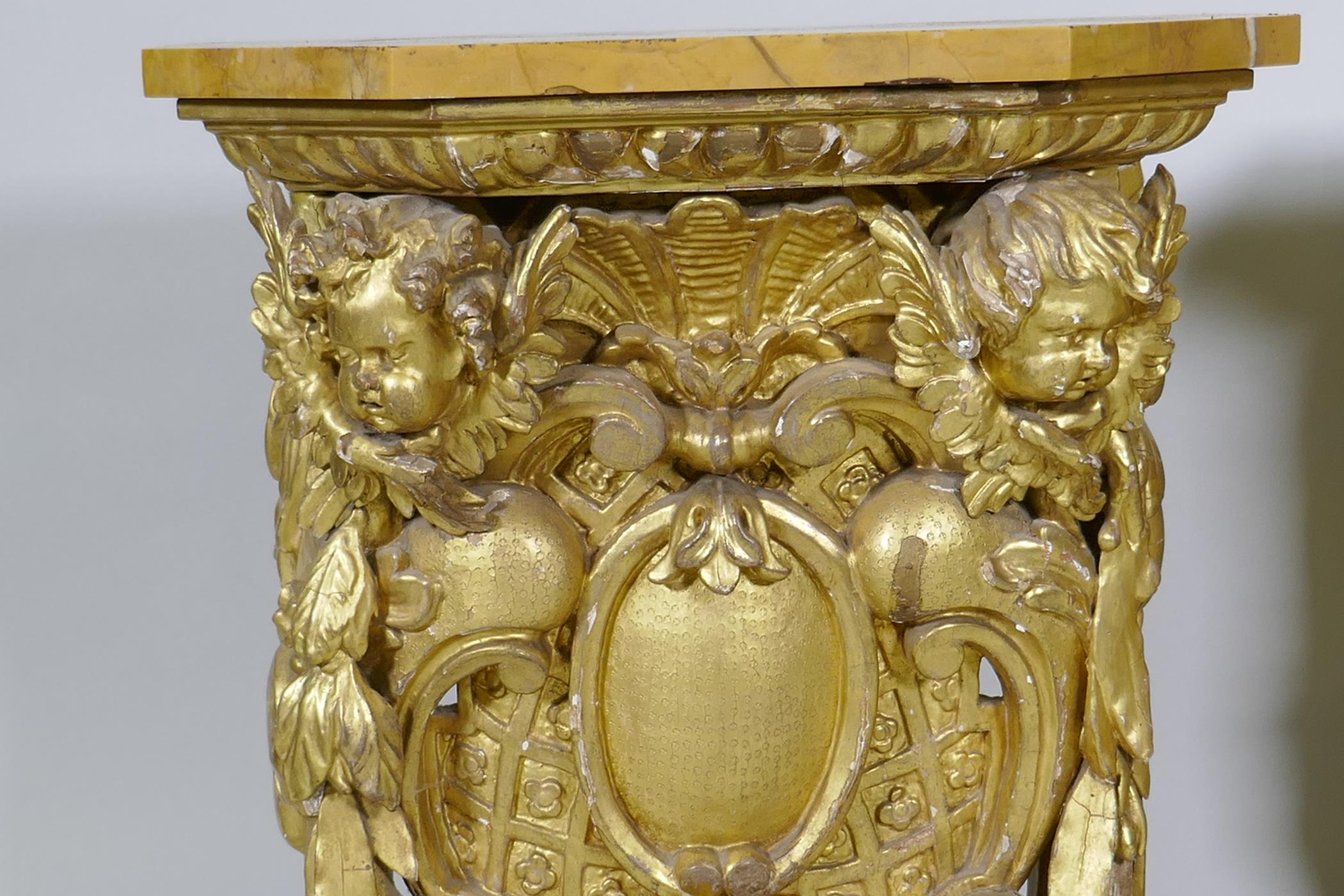 A pair of early C19th carved and giltwood pine pedestals/stands, decorated with winged putti and - Image 2 of 5